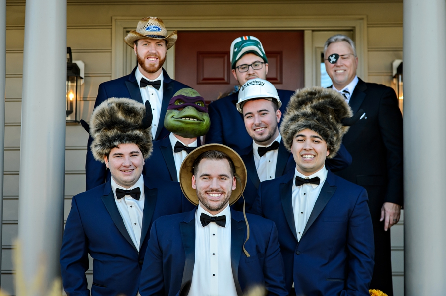 A silly moment of a groom with all of his groomsman.